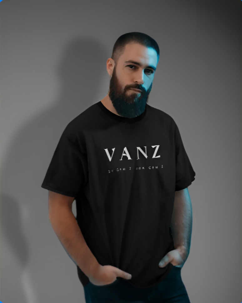 Man wearing a black Vans t-shirt with a blurred background